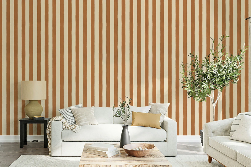 Living room with striped brown wallpaper, white sofa, and decorative elements.