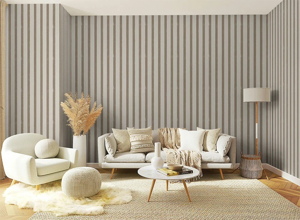 Living room with textured grey striped wallpaper, white sofa, armchair, and coffee table.