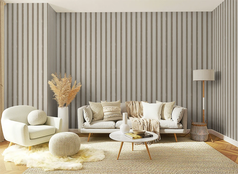 Living room with textured grey striped wallpaper, white sofa, armchair, and coffee table.