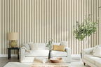 Living room with greige textured striped wallpaper, white sofa, and decorative elements.