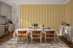 Modern Kitchen with a table, and a hand painted wallpaper with stripes of cream and yellow. 