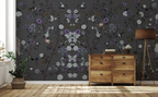 Room interior with floral chinoiserie wallpaper and wooden dresser.