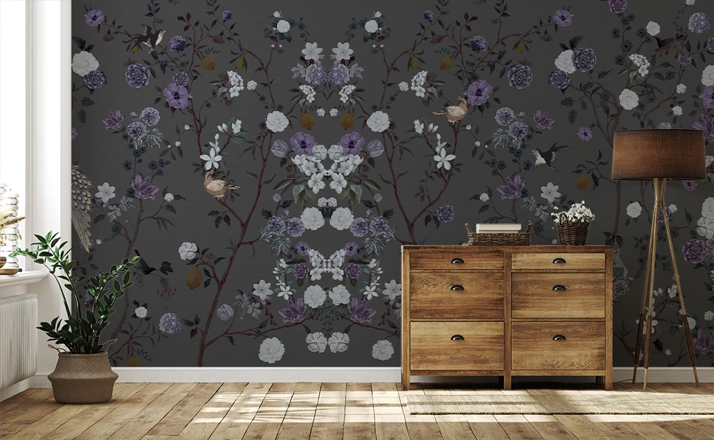 Room interior with floral chinoiserie wallpaper and wooden dresser.