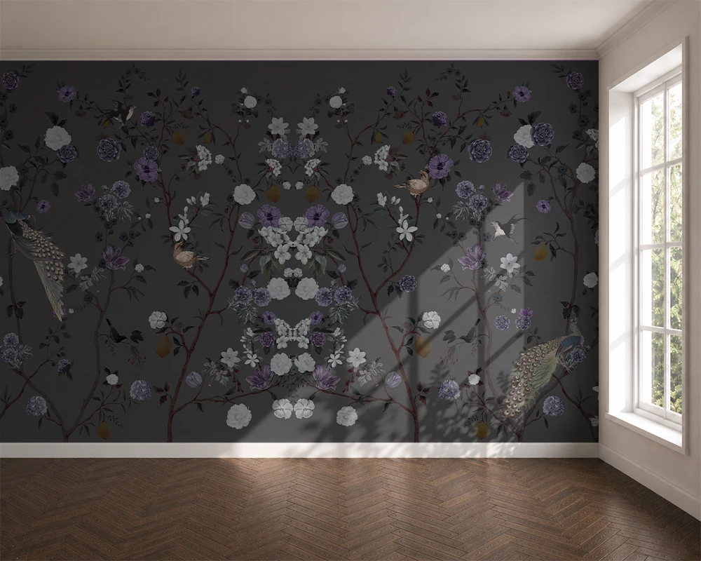 Room with floral chinoiserie wallpaper on a dark wall and a window letting in natural light.