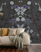 Living room with floral chinoiserie wallpaper, beige sofa, and colorful cushions.