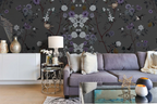 Living room with a gray sofa, decorative pillows, and a dark floral chinoiserie wallpapered wall.