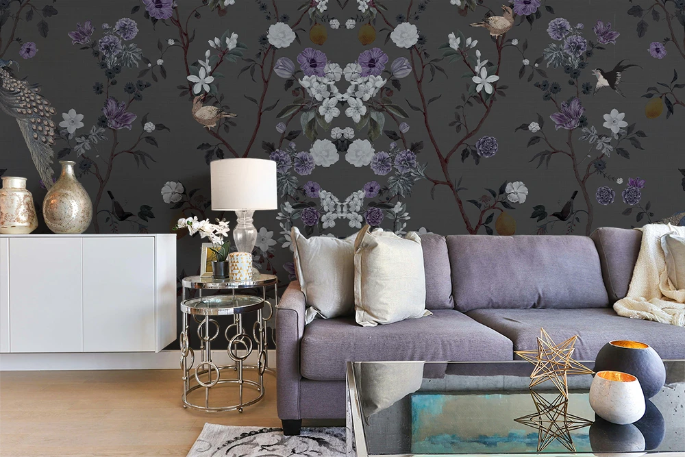 Living room with a gray sofa, decorative pillows, and a dark floral chinoiserie wallpapered wall.