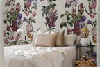 Floral wallpaper with roses, orchids, and varied botanicals in a pattern. 