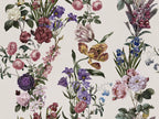Botanical floral wallpaper pattern featuring vintage-style illustrations of roses, tulips, lilies, and other flowers in pink, purple, yellow, blue, and white on a warm off-white background.