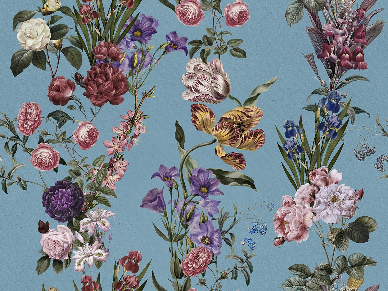 A vintage botanical pattern featuring an assortment of flowers including pink roses, purple irises, yellow tulips, and white blossoms on a dusty blue background.