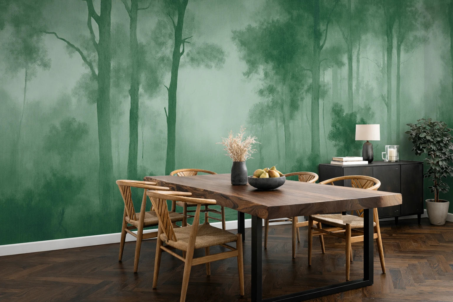 A dining room featuring a large green forest mural wallpaper on the wall behind a rustic wooden dining table and chairs.