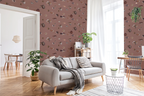 A modern living room with a grey sofa, scandinavian decor, a desk with a grey chair, and a wallpaper with a brown background featuring a pattern of vintage marine life illustrations. 