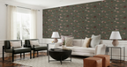 A styled living room featuring a prominent olive green wallpaper with a repeating pattern of small fish and shells, set behind a white sofa, two black armchairs, and modern side tables.