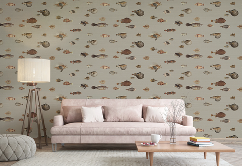 Modern living room with a grey sofa, floor lamp, and a wallpaper with a greige background featuring a pattern of vintage marine life illustrations. 
