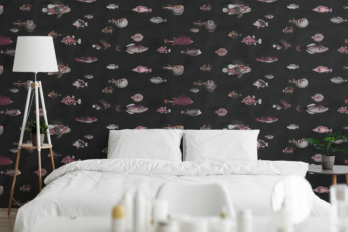 Bedroom with white beddings, a floor lamp, and a black wallpaper with a pattern of richly detailed, hand drawn vintage fish.