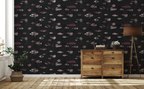 Hallway with wooden cabinet, a floor lamp, and a wallpaper with a black background featuring a pattern of vintage marine life illustrations. 