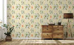 A room with wooden furniture, a potted plant on the floor, a standing lamp, and a wallpaper pattern of white lilies, orange tigers, on a cream yellow background. 