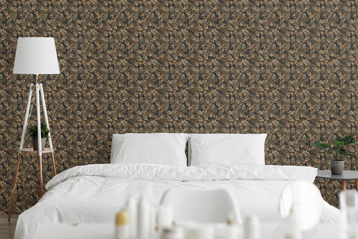 A modern bedroom with white linens, a wooden nightstand, and the wall features a tapestry wallpaper with an oak leaf pattern. 