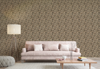 A modern living room with a beige sofa, a floor lamp, and a wall featuring a tapestry wallpaper in an oak leaf pattern. 