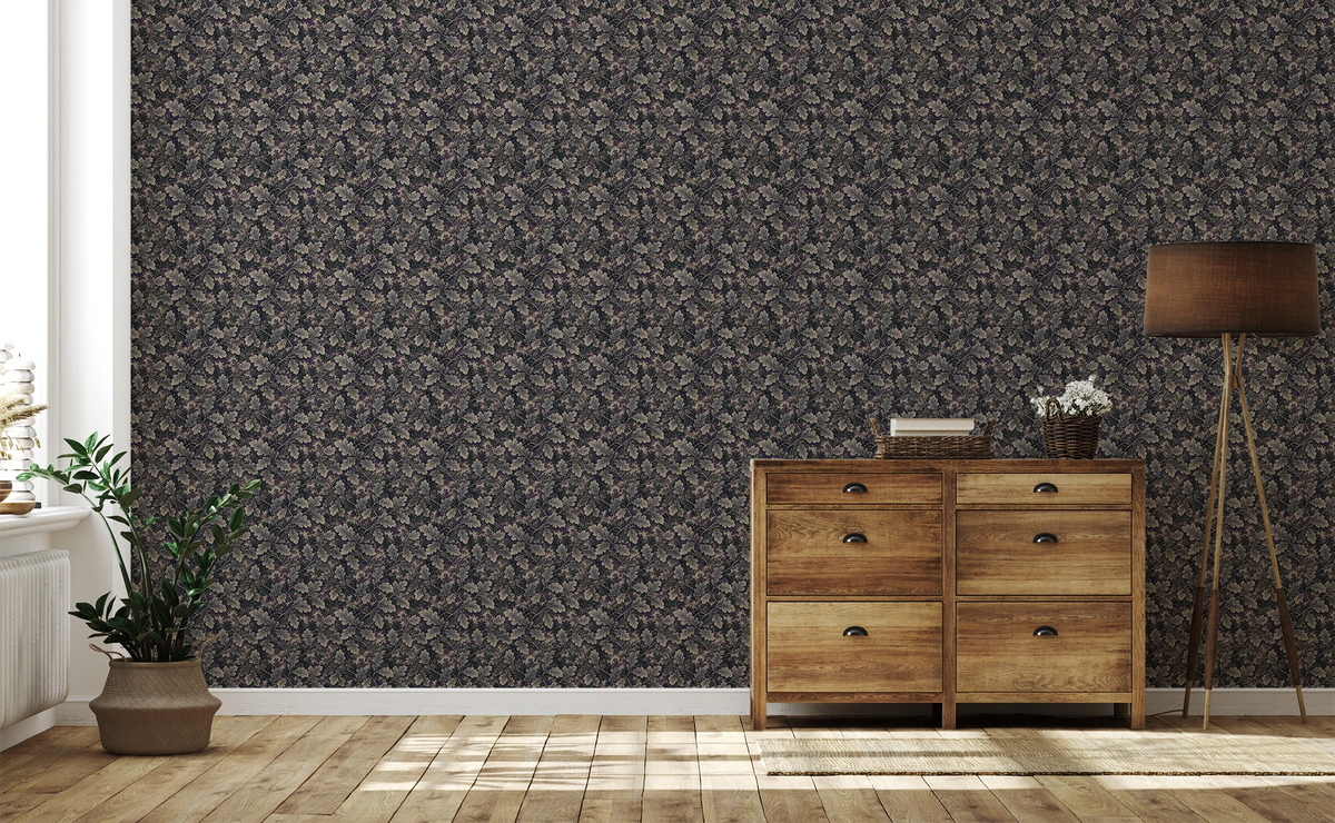 A living room with wooden cabinet, a floor lamp, plant, and a wall with a tapestry wallpaper featuring a dark oak leaf pattern. 