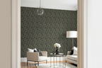 Modern living room with a white sofa, a glass sofa table, and a wall with a tapestry wallpaper featuring a green oak leaf pattern. 