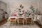Watercolor floral wallpaper with pink blooms and sage leaves in a Scandinavian kitchen with cream cabinets.