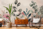 Watercolor floral wallpaper in a mid-century modern living room with a wooden cabinet, black wire chair and potted palm.