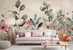 Oversized watercolor floral wallpaper in a pastel living room with a blush white sofa and wooden coffee table.