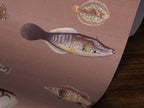 Wallpaper pattern with vintage marine life illustrations on a brown colored background. 