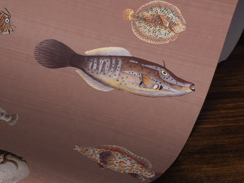 Wallpaper pattern with vintage marine life illustrations on a brown colored background. 