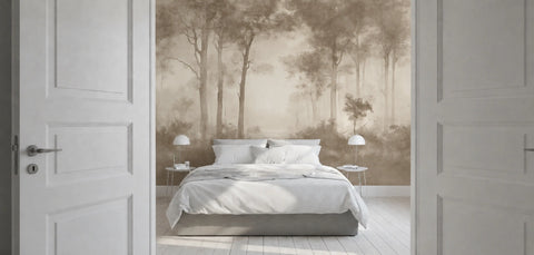A bedroom interior viewed through open white doors, centered on a bed with white bedding and a large wallpaper mural showing a misty forest scene in soft beige and brown tones.