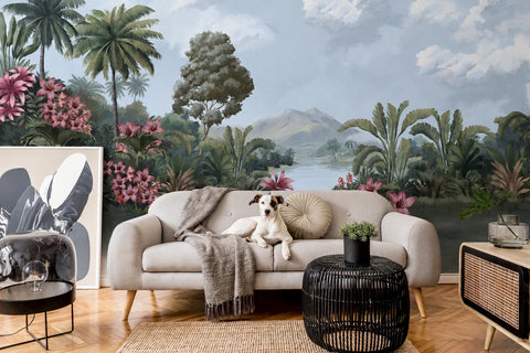 Living room with a sofa, coffee table, and decorative wallpaper mural of a tropical landscape.